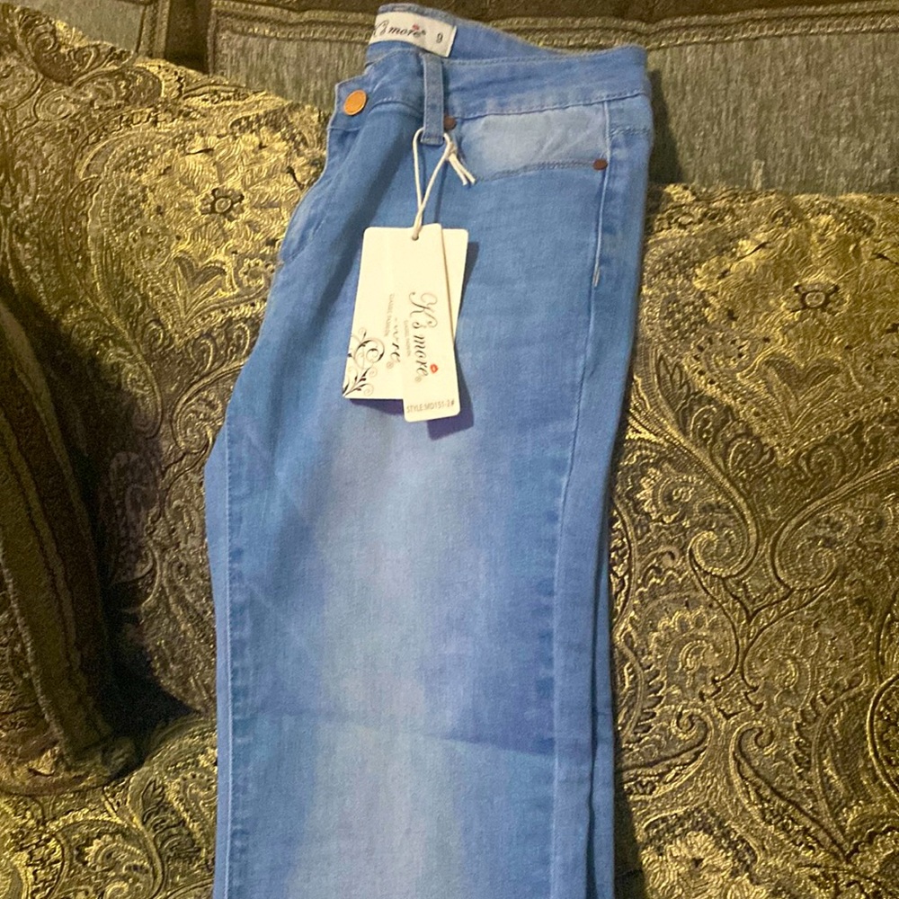 Cropped cross leg jeans